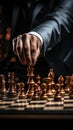 Selective focus Mans hand in chess play, metaphorically guiding strategic business decisions