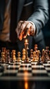 Selective focus Mans hand in chess play, metaphorically guiding strategic business decisions