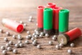 Selective focus of Many Bullet of Shotgun on wooden background with sunlight