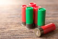 Selective focus of Many Bullet of Shotgun on wooden background with sunlight