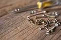 Selective focus of Many sizes screwdriver and screw nut on the  wood background Royalty Free Stock Photo