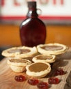 Selective focus of maple cream tarts on a wooden surface