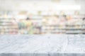 Selective focus.Marble table top on blur of supermarket product shelf background Royalty Free Stock Photo