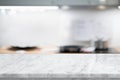 Selective focus,Marble table top on blur white kitchen room background