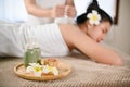 Selective focus, Massage oil bottles, body scrub and frangipani flowers on massage table Royalty Free Stock Photo