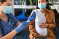 Doctor Taking Dose Of Covid-19 Vaccine For Pregnant Woman