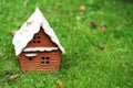 Selective focus on a miniature house on a green lawn.  Blurri Royalty Free Stock Photo