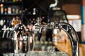 Selective focus of modern beer taps in pub Royalty Free Stock Photo