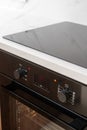 Black electric oven with timer display in kitchen Royalty Free Stock Photo