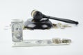 Selective focus of money , coins and judge gavel over white background Royalty Free Stock Photo