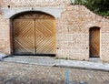 selective focus on monochrome brick wall with gate and door