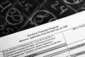 selective focus monochrome photo of paycheck protection program borrower application form revised, on a background of chalk board Royalty Free Stock Photo