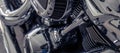 Selective focus on a motorcycle engine. Shiny chrome motorbike engine detail. Vintage motorbike. Closeup motorcycle air filter. Royalty Free Stock Photo