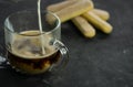 selective focus, mug of hot coffee with cream and cookies Royalty Free Stock Photo