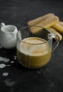 selective focus, mug of hot coffee with cream and cookies Royalty Free Stock Photo