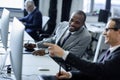 selective focus of multicultural businessmen having conversation at workplace Royalty Free Stock Photo