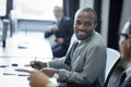 selective focus of multicultural businessmen having conversation at workplace Royalty Free Stock Photo