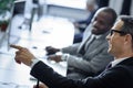 selective focus of multicultural businessmen having conversation at workplace Royalty Free Stock Photo