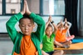 Selective focus of multicultural children meditating