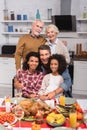 Focus of multicultural family embracing during