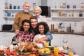 Focus of multicultural family hugging while