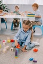 selective focus of multiracial preschoolers playing with blocks Royalty Free Stock Photo
