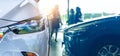 Selective focus a new car on blur saleswoman and customer in modern luxury showroom. Car dealership office concept. Dealer agent Royalty Free Stock Photo