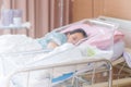 Selective focus of newborn baby boy and new mother sleeping in a hospital Royalty Free Stock Photo