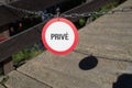 Selective focus of a no passage "prive" sign Royalty Free Stock Photo