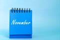 Selective focus of November calendar with turkey decoration. Hello November month