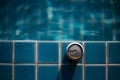 selective focus, one can of white beer placed on the edge of the pool bright blue water background feel fresh The background image Royalty Free Stock Photo