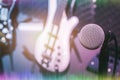 Selective focus one of microphone with the blur of electric bass and guitar Royalty Free Stock Photo