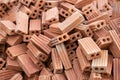 selective focus orange brick blocks piled on the floor orange bricks used to build houses and buildings used to build walls Royalty Free Stock Photo