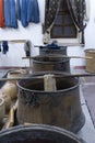 selective focus os a pots for the handmade dyeing of wool or silk, with pots with natural products for dyeing, and skeins of wool Royalty Free Stock Photo