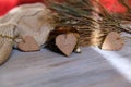 Selective focus and partial blur of decorative hearts with warm plaid, shadow and sunlight, interior details of authentic home