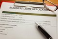 selective focus pen,Business loan application form,glasses ,red Royalty Free Stock Photo