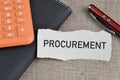 Selective focus of pen, notebook, calculator and torn and paper with text PROCUREMENT Royalty Free Stock Photo