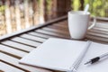 Selective focus of Pen, notebook , coffee cup on the wooden table and copy space Royalty Free Stock Photo