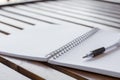 Selective focus of Pen, notebook on the wooden table and copy space Royalty Free Stock Photo