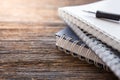 Selective focus of Pen, notebook on the wooden table and copy space  with sunlight Royalty Free Stock Photo