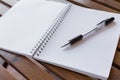 Selective focus of Pen, notebook on the wooden table and copy space Royalty Free Stock Photo