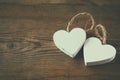 Selective focus photo of couple of wooden hearts on rustic table. valentine's day celebration concept.