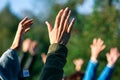 Group of people putting their hands up in the air Royalty Free Stock Photo