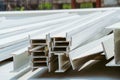 Selective focus. Photo of steel I-beam used in steel frame construction, I-beam steel, I-beam steel painted white lay piles on con