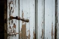 Selective focus photography. Old wooden door with damaged paint. Royalty Free Stock Photo