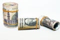 Selective focus of pile of Pile of American dollars rolls with rolled up Egyptian money banknote bills of 100 LE, 200 LE