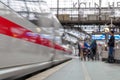 Cologne central railway station with blur background of motion of High speed train and group of passengers in Cologne, Germany.