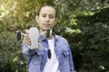 Selective focus portrait of a portable quadricopter drone with 4K camera held in his hand of a young boy Royalty Free Stock Photo