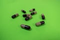 Seattle, WA USA - circa November 2022: Selective focus on Prazosin pills on a green background