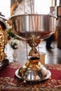 Selective focus. A priest`s censer hangs on an old wall in the Orthodox Church. Copper incense with burning coal inside. Service Royalty Free Stock Photo